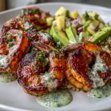 Zesty mango salsa, packed with red onion and fresh cilantro, tops the Fresh Shrimp and Creamy Avocado Bowls for a bright, crunchy finish.