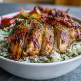 Colorful Lemon Herb Roasted Chicken Bowl featuring herb-marinated chicken, caramelized vegetables, and lemon dressing, perfect for a healthy dinner. A fresh, gluten-free main dish.