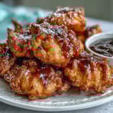 Crispy dandelion fritters with herb dipping sauce, golden fried flowers served with a creamy, fresh herb yogurt dip.