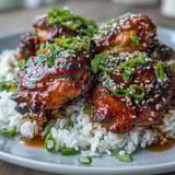 Slow cooker honey garlic chicken with tender meat and glossy glaze, perfect for a comforting dinner.  
