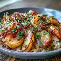 Warm apple and sauerkraut skillet salad, a vibrant, tangy side dish.